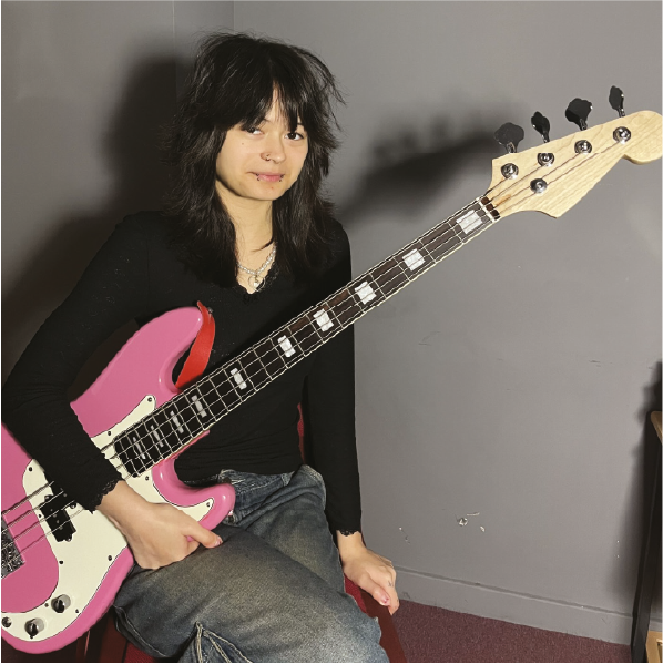 Student with a pink guitar
